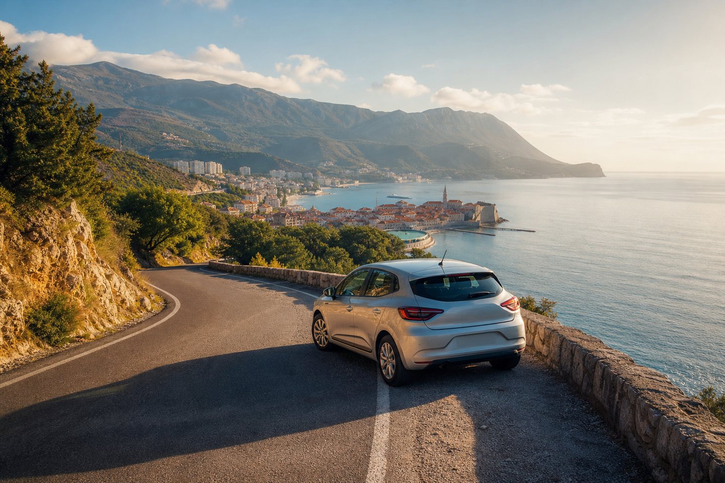 Compact rental car beside Budva coast and Adriatic Sea